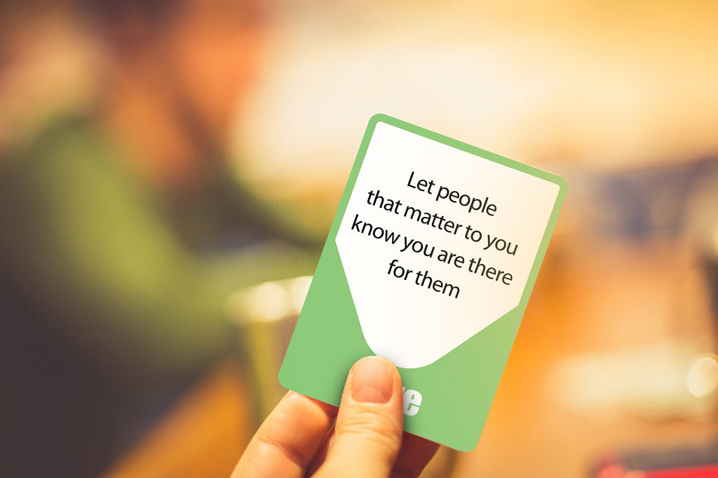 A hand holding an RRT card
